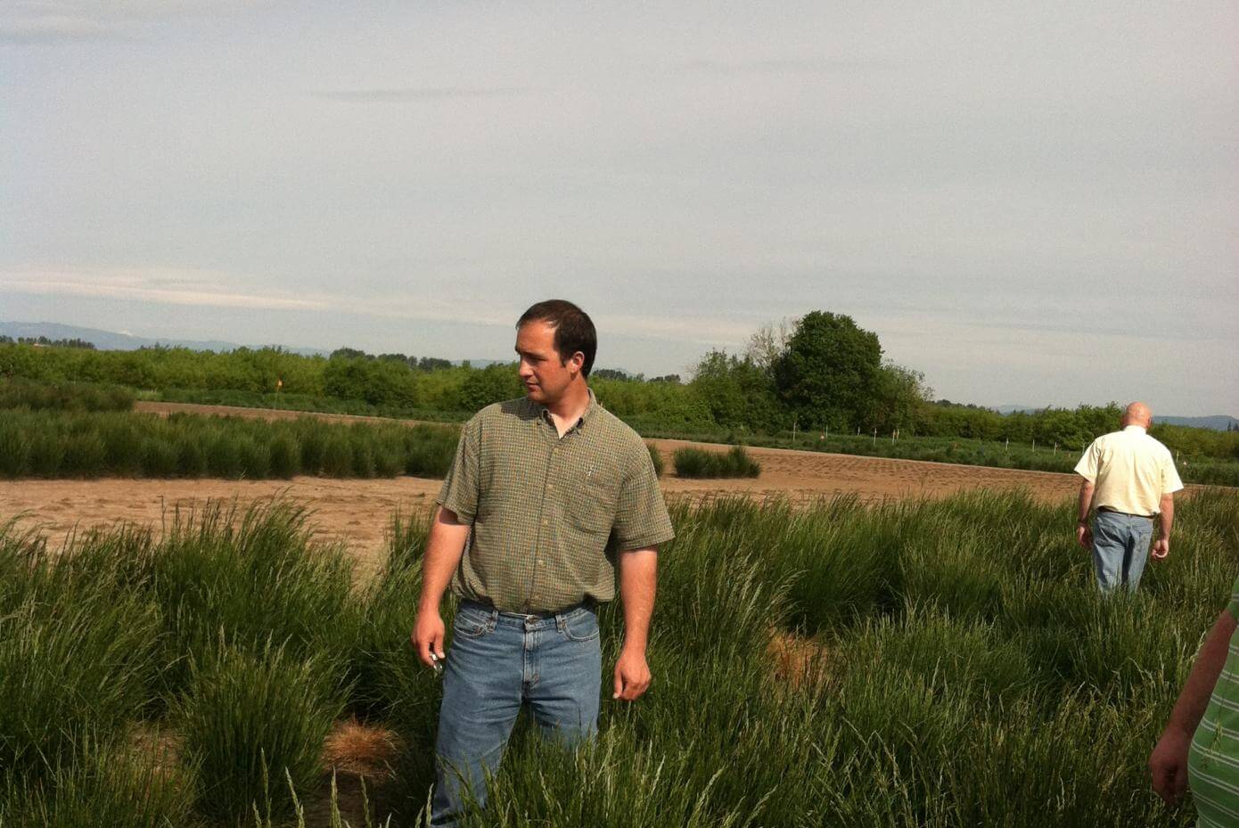man standing a field
