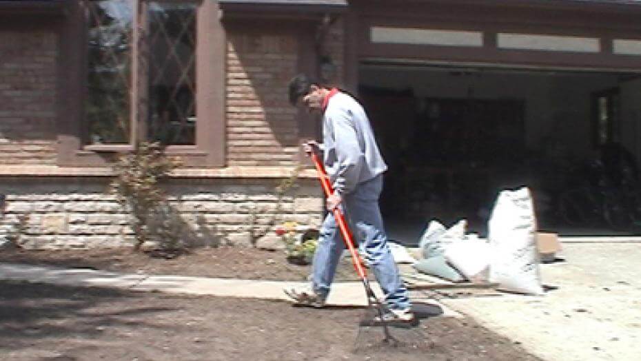 A man raking